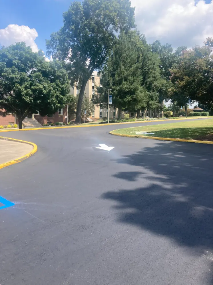 Freshly paved asphalt road outside of a university